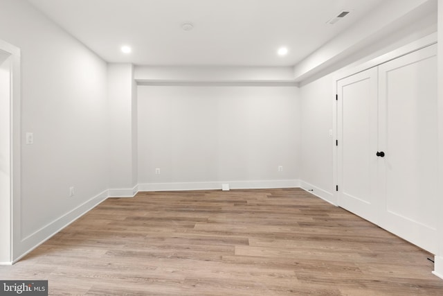 empty room with light hardwood / wood-style floors