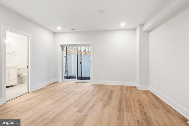 spare room with light wood-type flooring