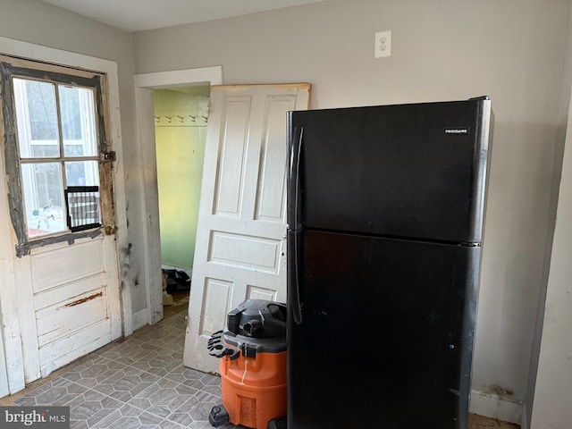 kitchen featuring black fridge