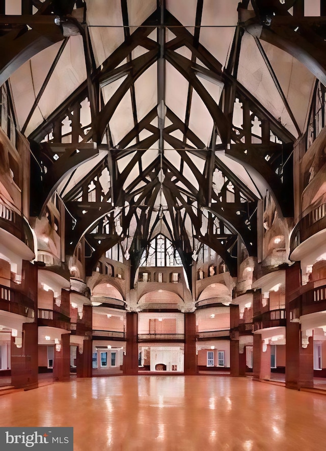 wine cellar featuring a towering ceiling