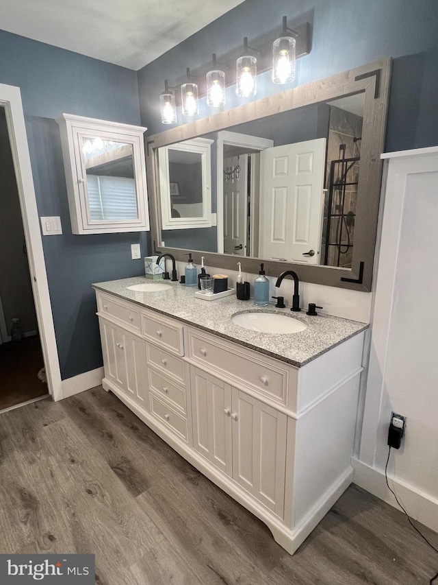 bathroom featuring vanity and hardwood / wood-style flooring