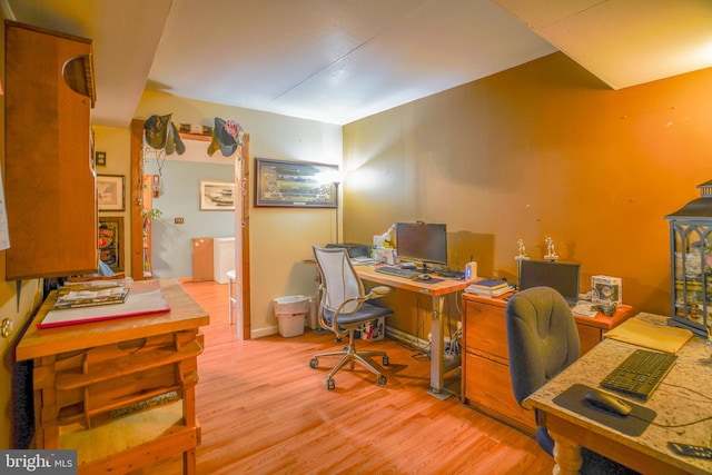 office space with light hardwood / wood-style flooring