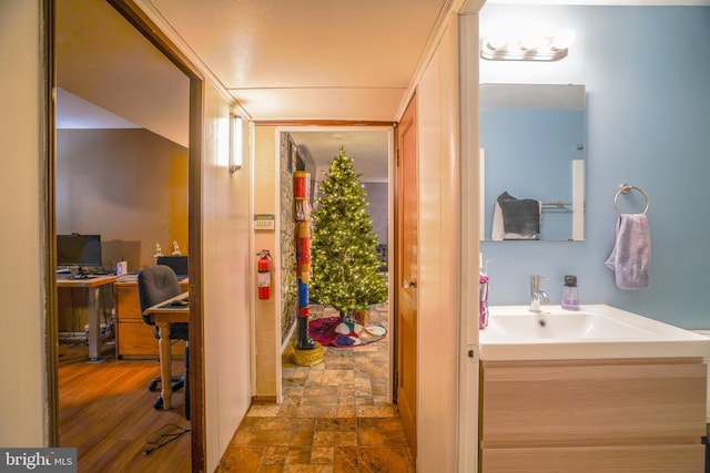 bathroom featuring vanity and hardwood / wood-style flooring