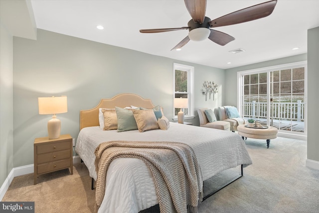 carpeted bedroom featuring ceiling fan and access to exterior