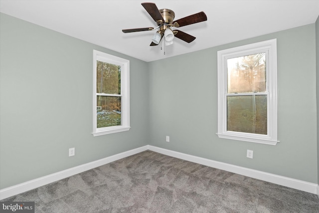 unfurnished room with ceiling fan and light colored carpet