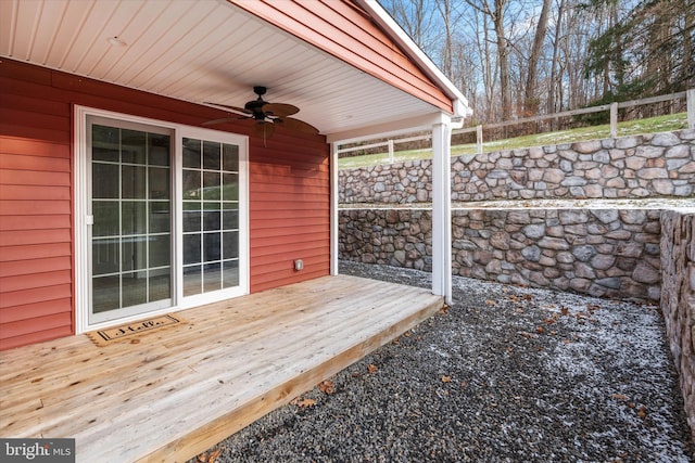 wooden terrace featuring ceiling fan