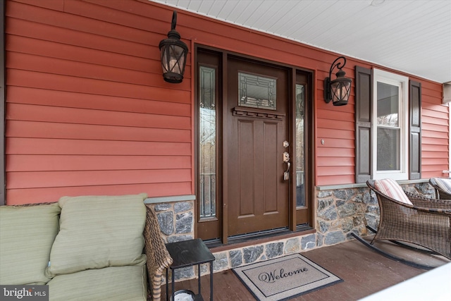 doorway to property featuring a porch