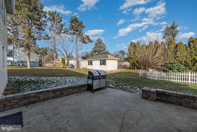 view of patio / terrace featuring grilling area and an outdoor structure