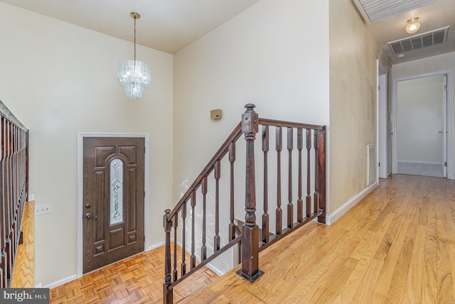 entryway with an inviting chandelier