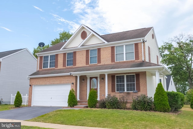 view of front of home with a garage and a front yard