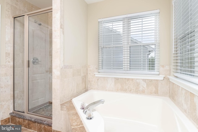 bathroom featuring plus walk in shower