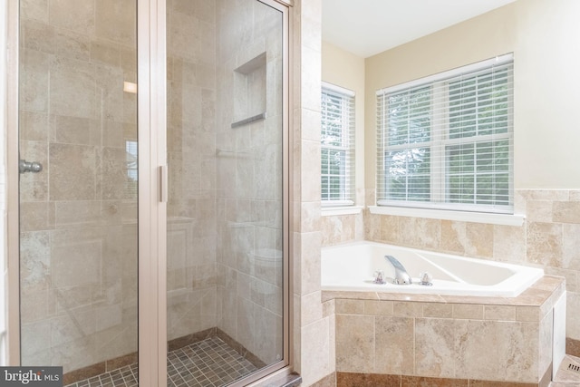 bathroom with separate shower and tub