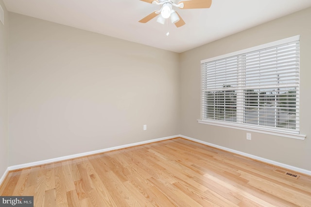 unfurnished room with light wood-type flooring and ceiling fan