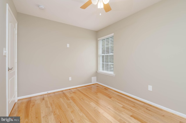 unfurnished room featuring hardwood / wood-style floors and ceiling fan