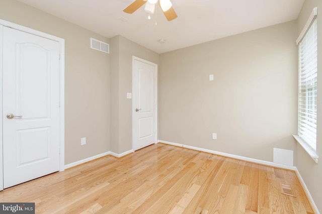 unfurnished bedroom featuring a closet, ceiling fan, and hardwood / wood-style floors