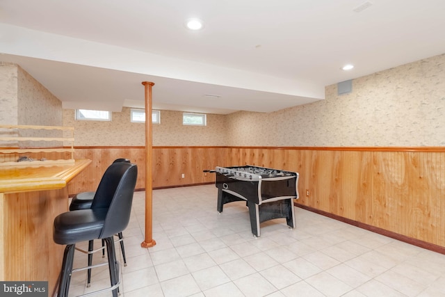 playroom with wooden walls