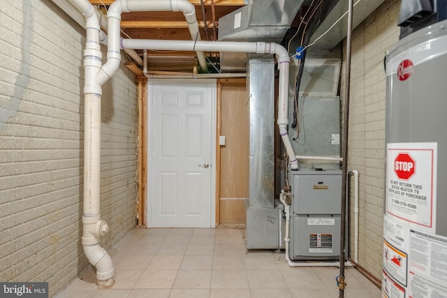 utility room with gas water heater