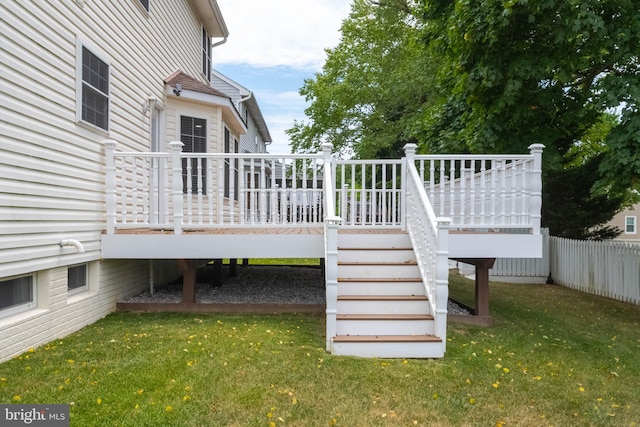 wooden terrace with a lawn