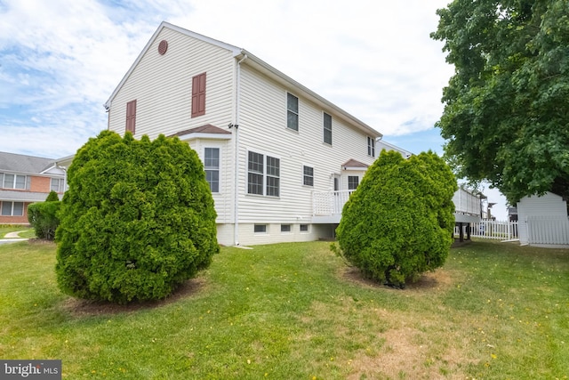 view of home's exterior featuring a yard