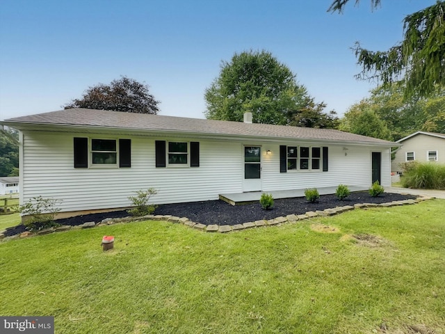 ranch-style house with a front yard