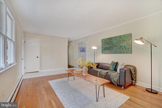 living room featuring wood-type flooring, crown molding, and a baseboard heating unit