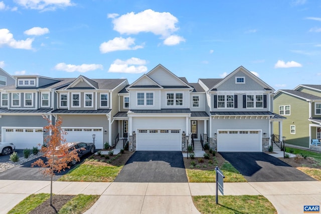 multi unit property featuring a garage