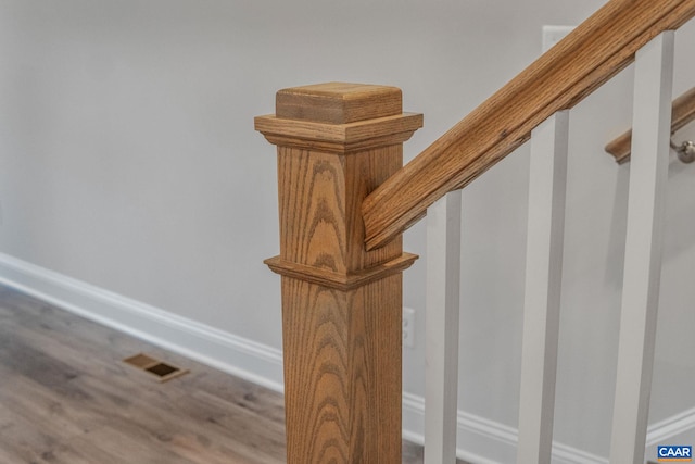 stairway featuring wood-type flooring