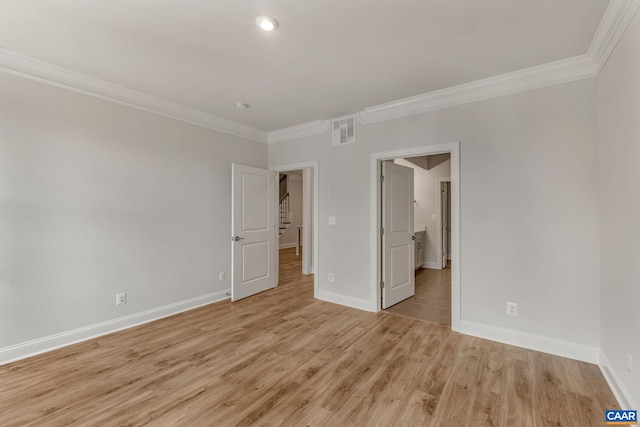 unfurnished bedroom with ornamental molding and light wood-type flooring