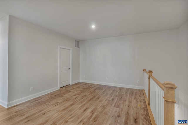 spare room featuring light hardwood / wood-style flooring