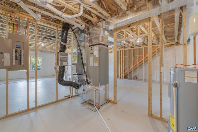 basement featuring heating unit, electric panel, and water heater