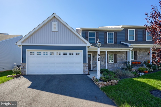 view of front of property with a porch and a garage