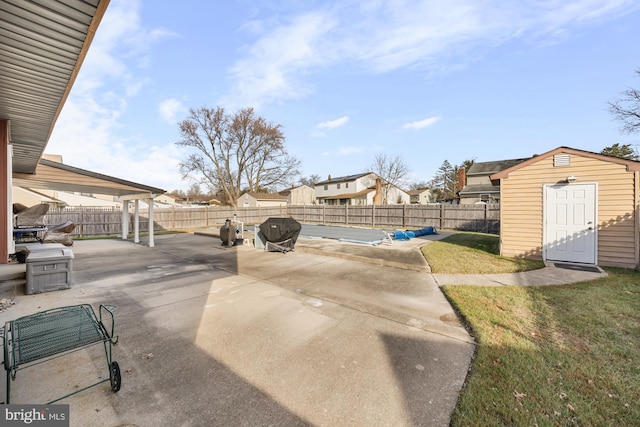 view of patio featuring a storage shed