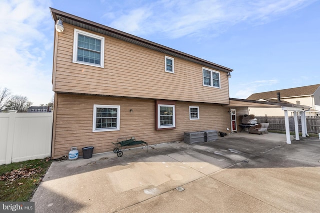 back of house featuring a patio