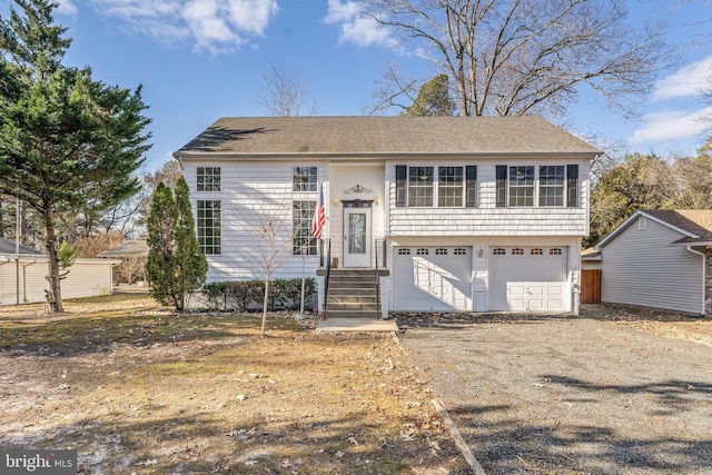 bi-level home featuring a garage