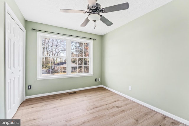 interior space with ceiling fan and light hardwood / wood-style flooring