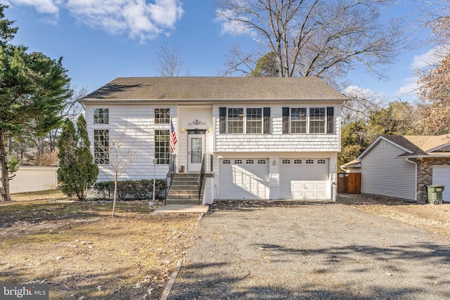 split foyer home featuring a garage