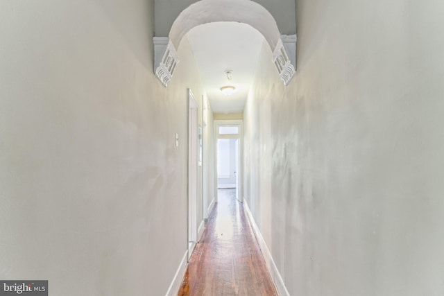 hall with wood-type flooring