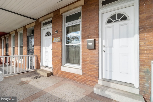 entrance to property with a porch