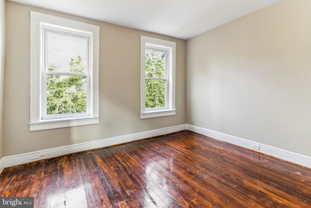 empty room featuring dark hardwood / wood-style floors