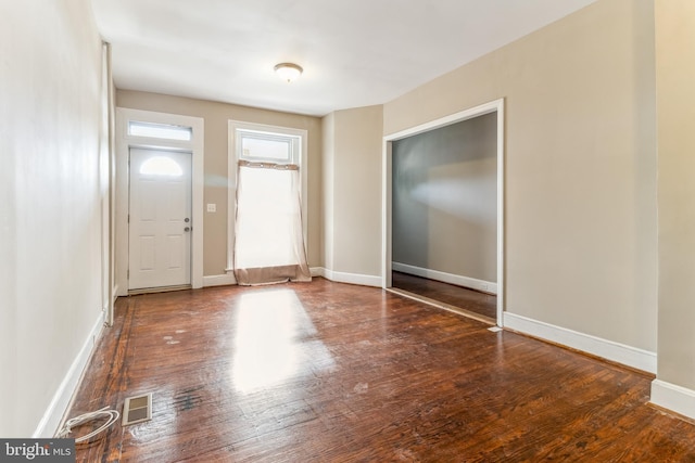 entrance foyer with dark hardwood / wood-style floors