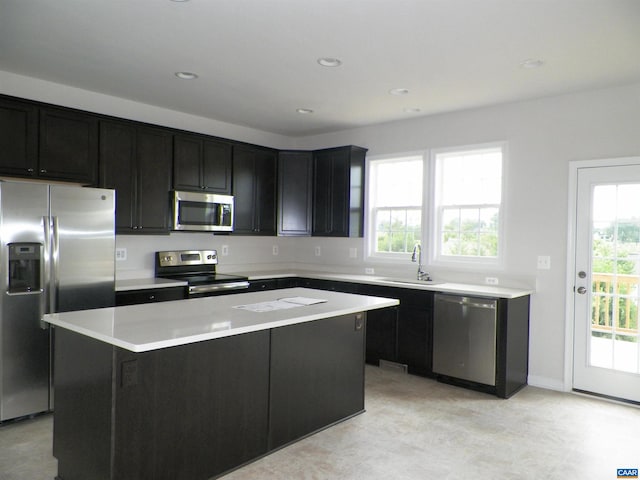 kitchen with a center island, sink, and stainless steel appliances