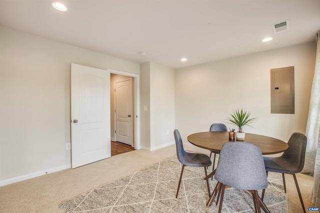 dining room with carpet and electric panel