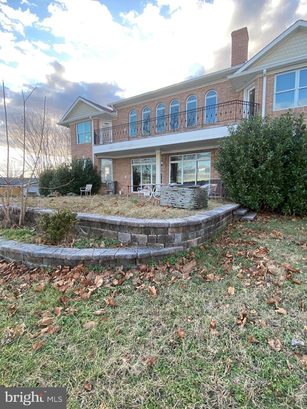 view of front of home with a balcony