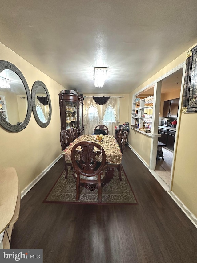 dining space featuring hardwood / wood-style flooring