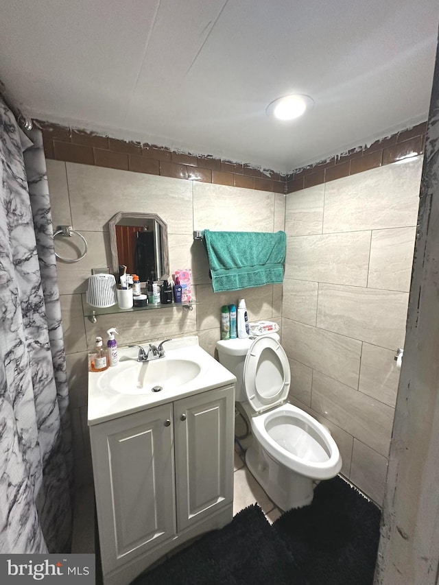 bathroom with toilet and vanity