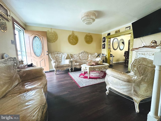 living room featuring dark wood-type flooring and crown molding