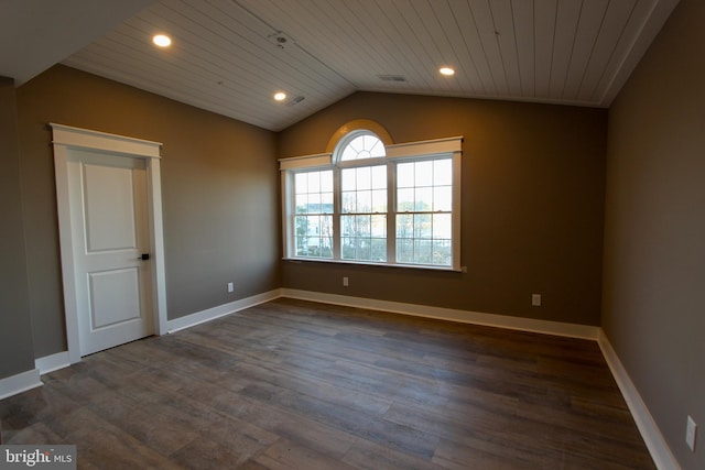 spare room with dark hardwood / wood-style floors, wood ceiling, and vaulted ceiling