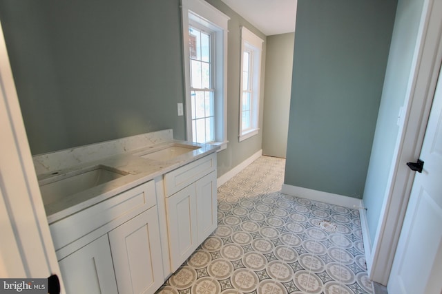 bathroom featuring tile patterned flooring and vanity