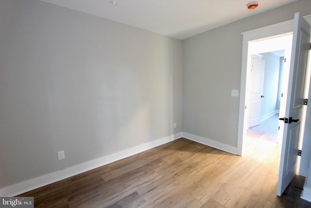 empty room with light hardwood / wood-style floors