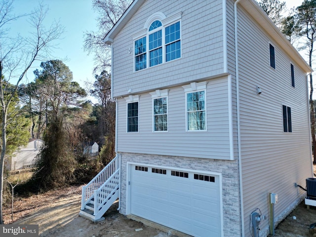 view of side of home featuring a garage